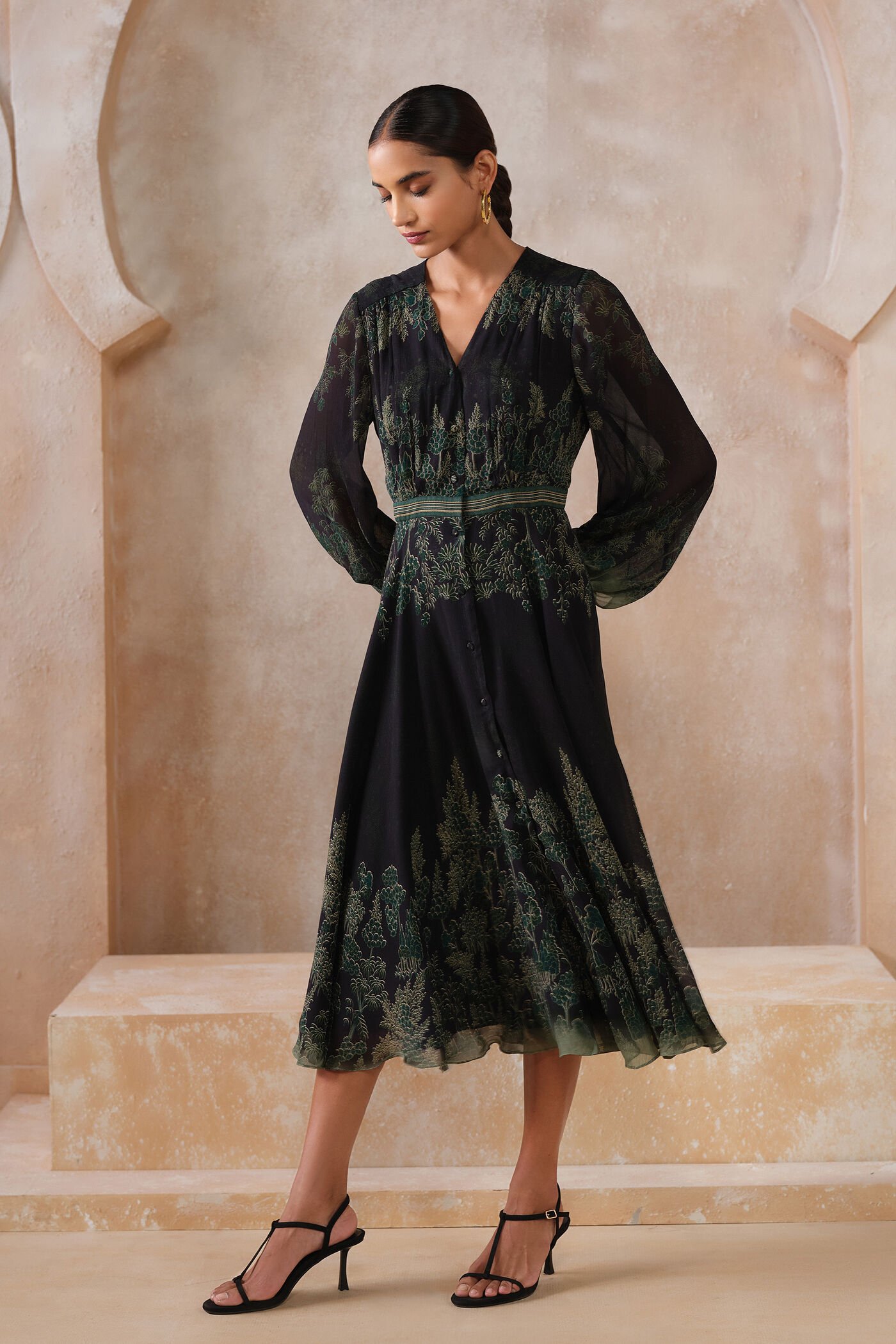 Black embroidered midi dress with green forest-inspired detailing and sheer sleeves, elegant designer festive wear for women