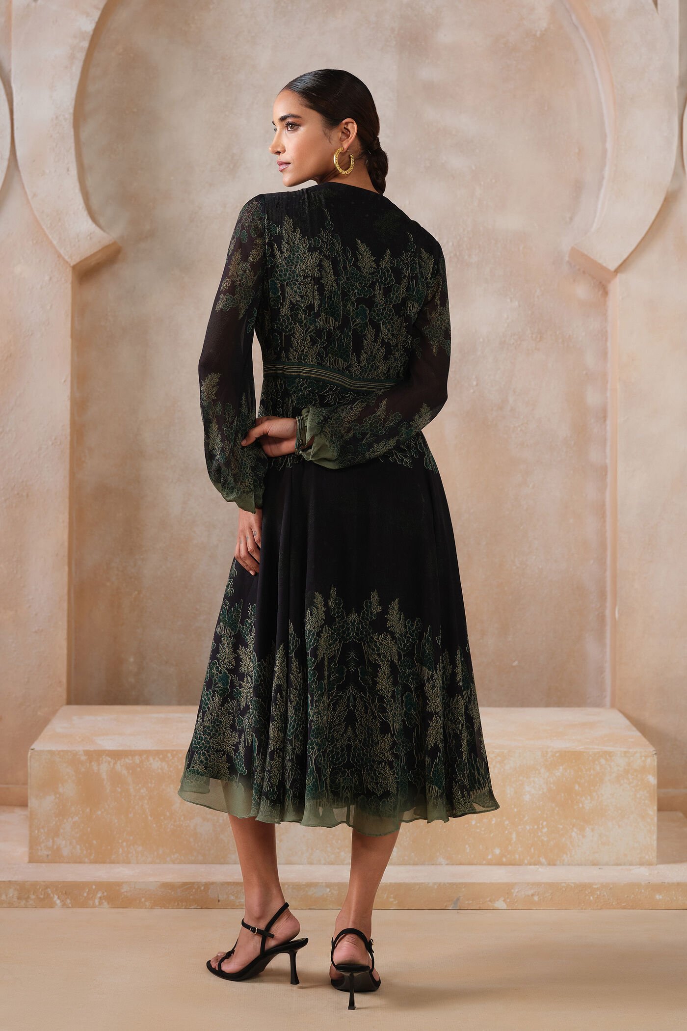 Black embroidered midi dress with green forest-inspired detailing and sheer sleeves, elegant designer festive wear for women
