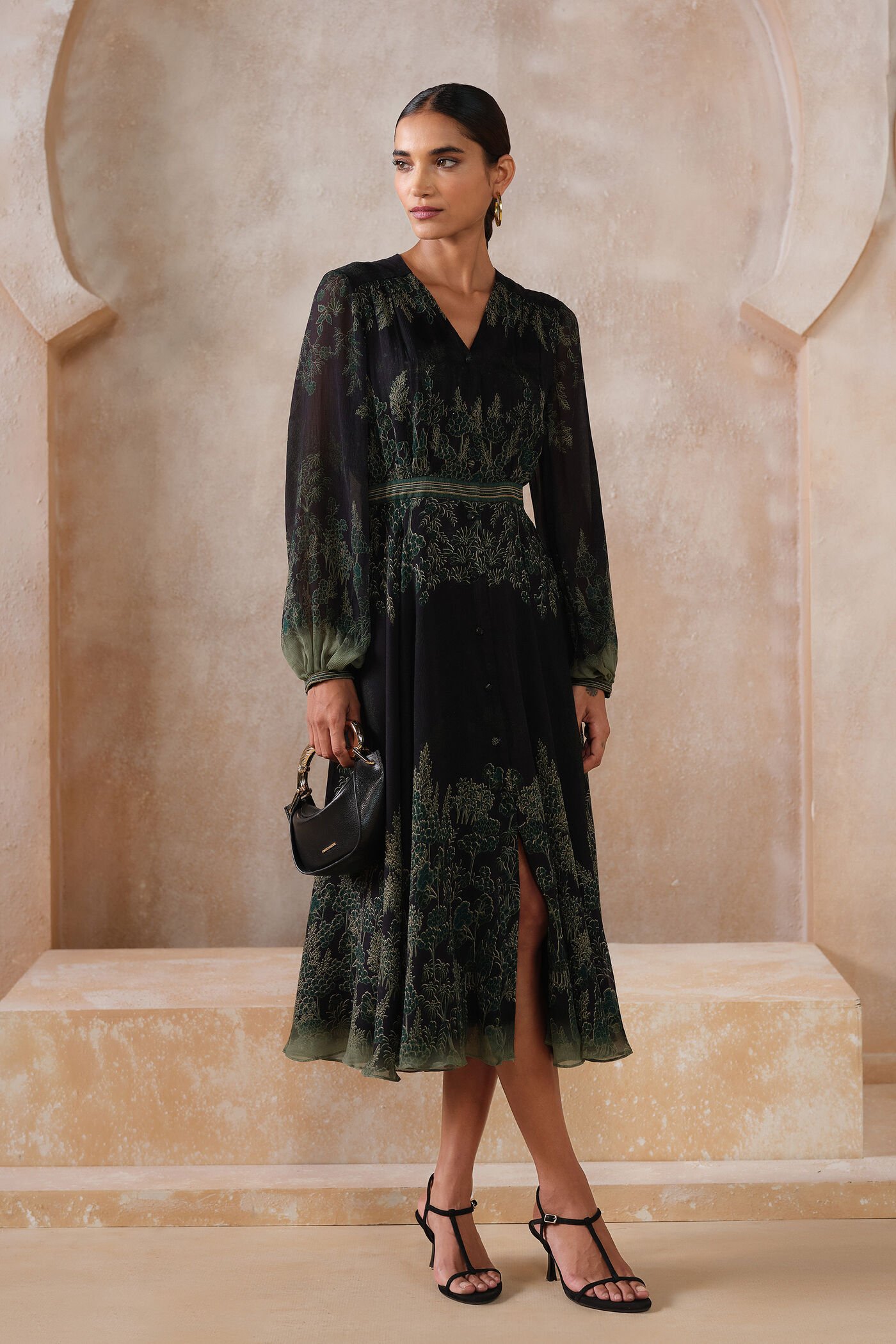 Black embroidered midi dress with green forest-inspired detailing and sheer sleeves, elegant designer festive wear for women