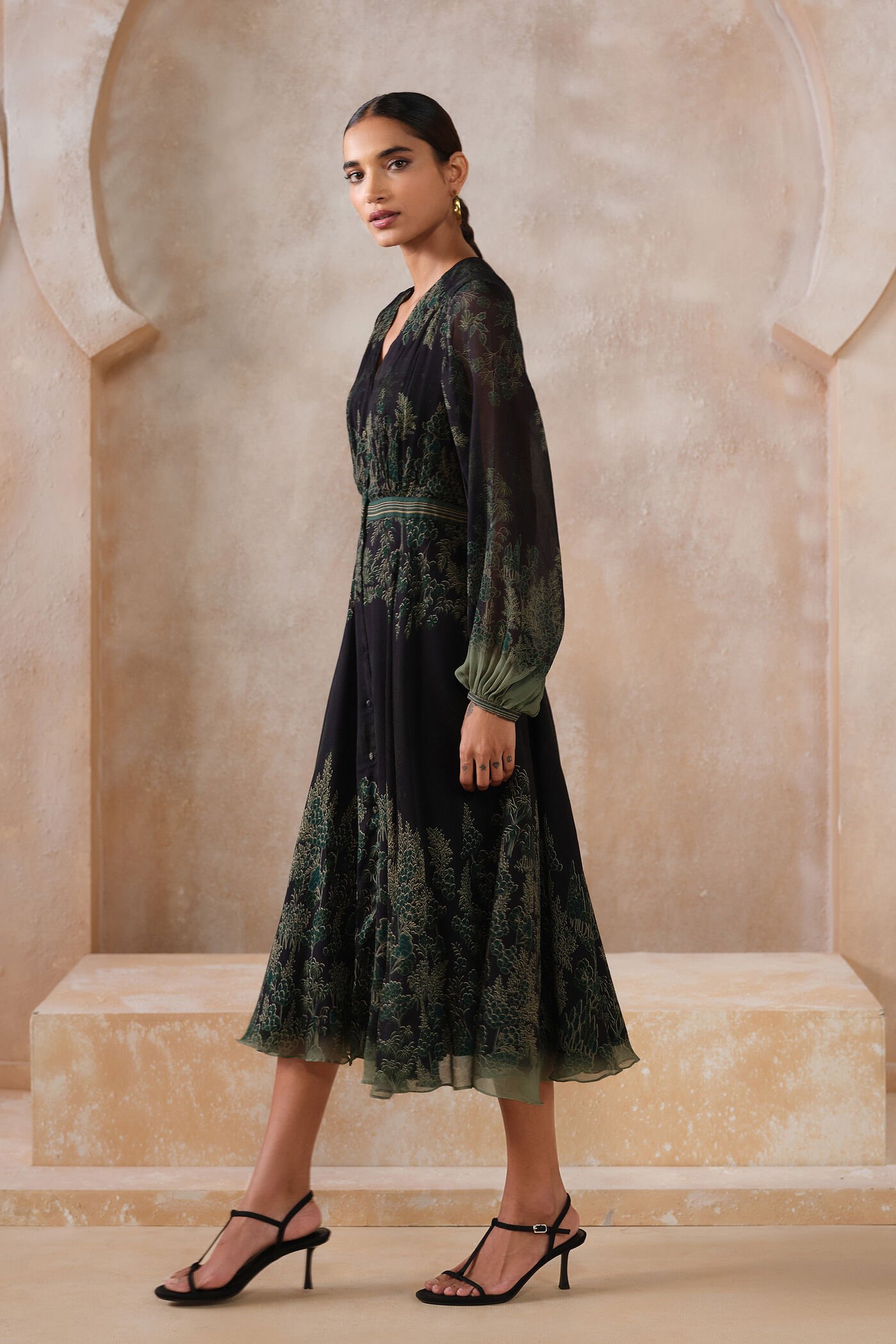 Black embroidered midi dress with green forest-inspired detailing and sheer sleeves, elegant designer festive wear for women