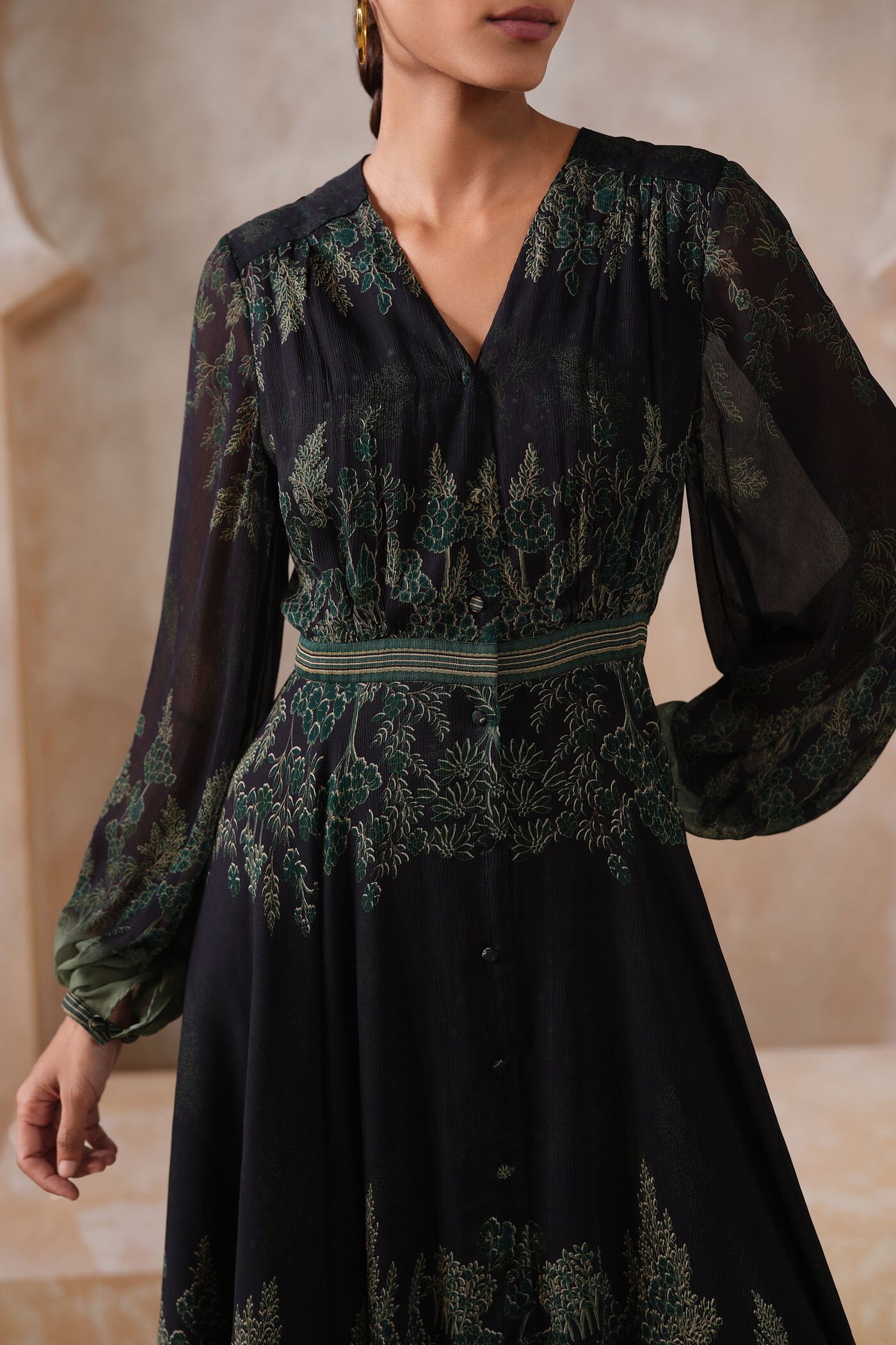 Black embroidered midi dress with green forest-inspired detailing and sheer sleeves, elegant designer festive wear for women