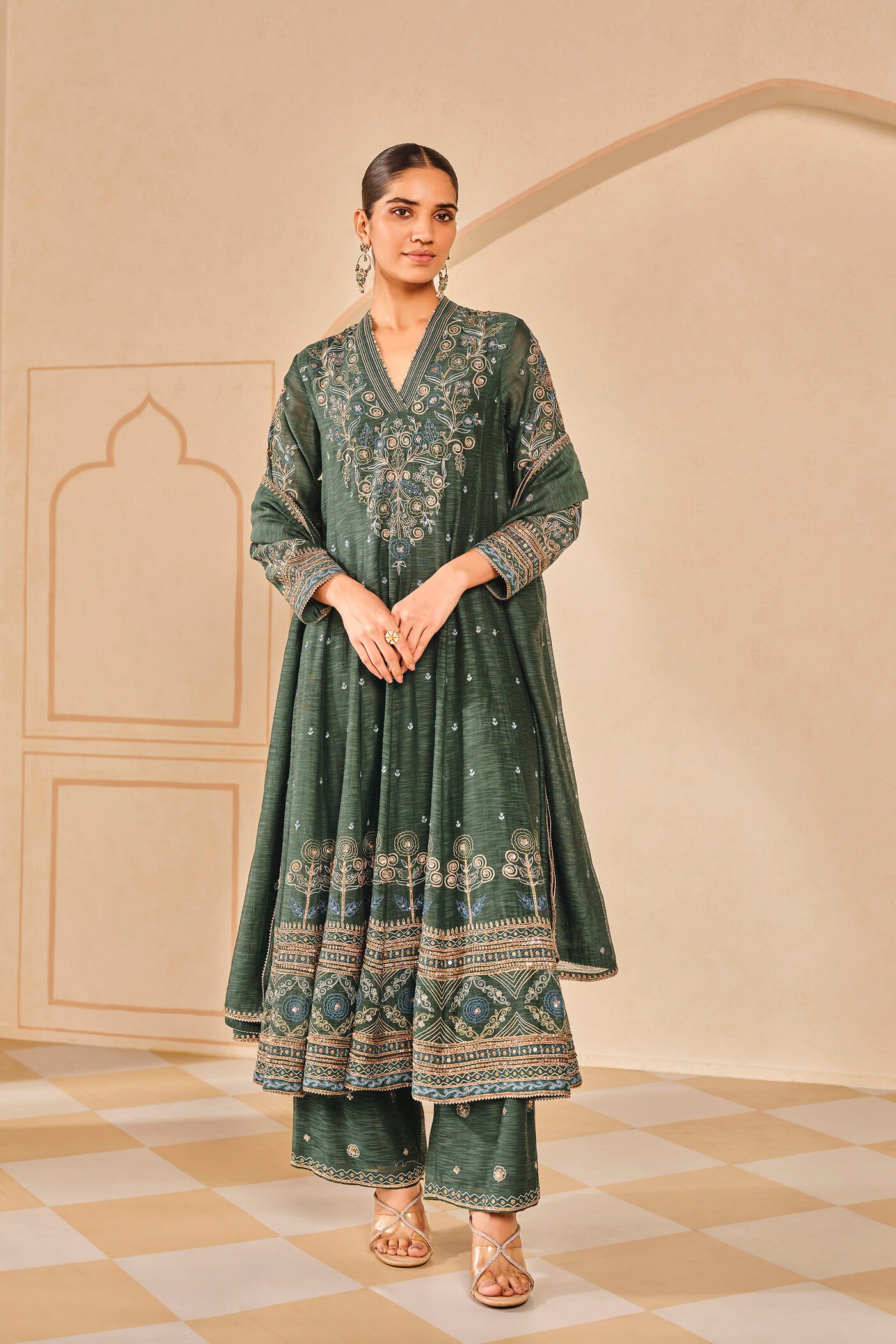 Dark green embroidered kurta set with palazzo pants, traditional Indian festive wear for women