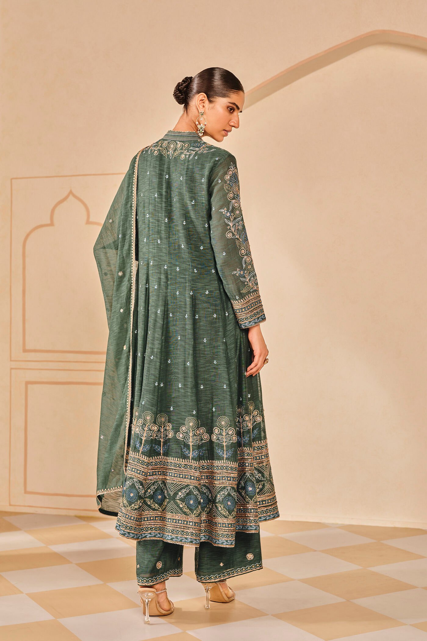 Dark green embroidered kurta set with palazzo pants, traditional Indian festive wear for women