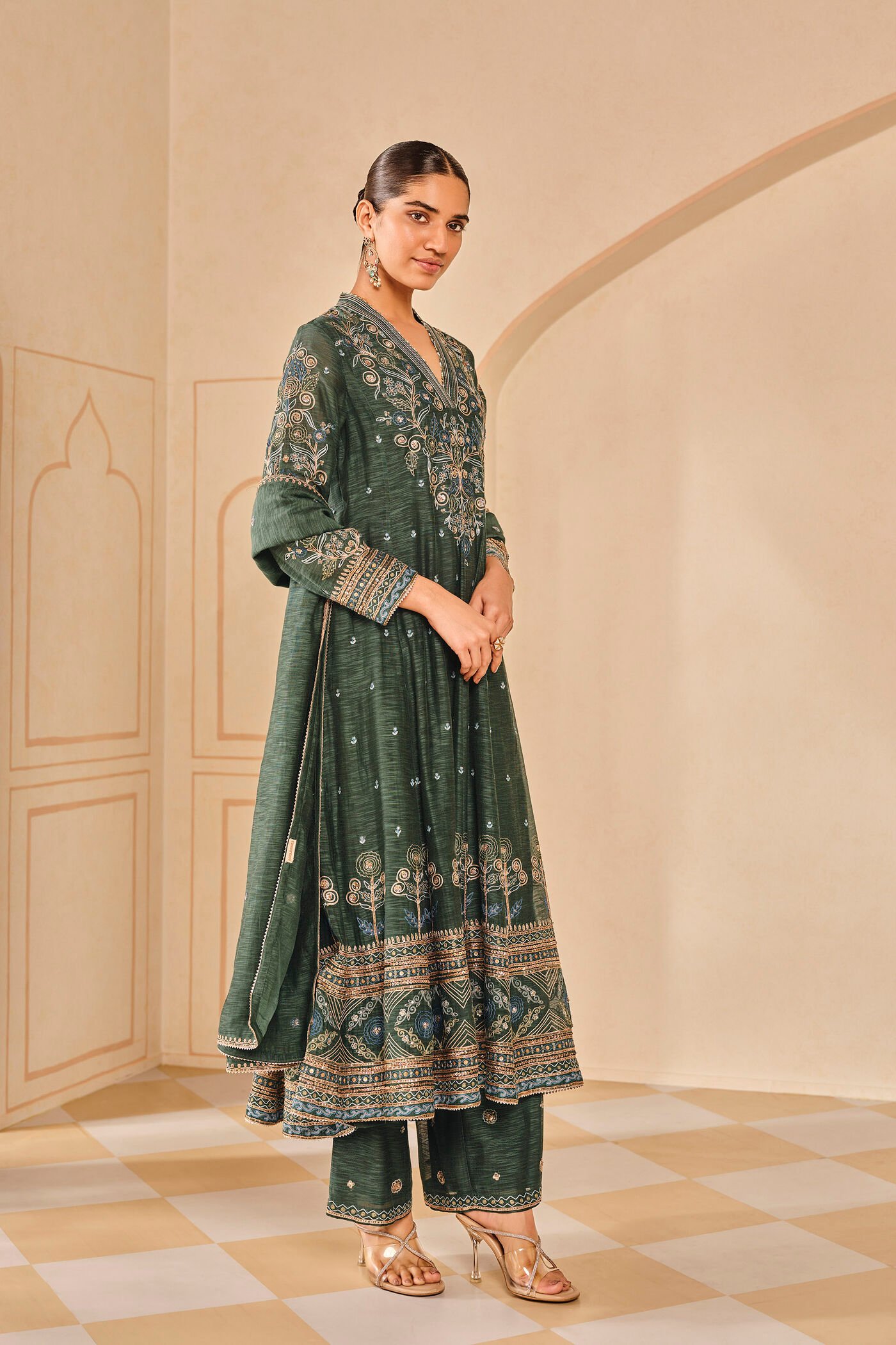 Dark green embroidered kurta set with palazzo pants, traditional Indian festive wear for women