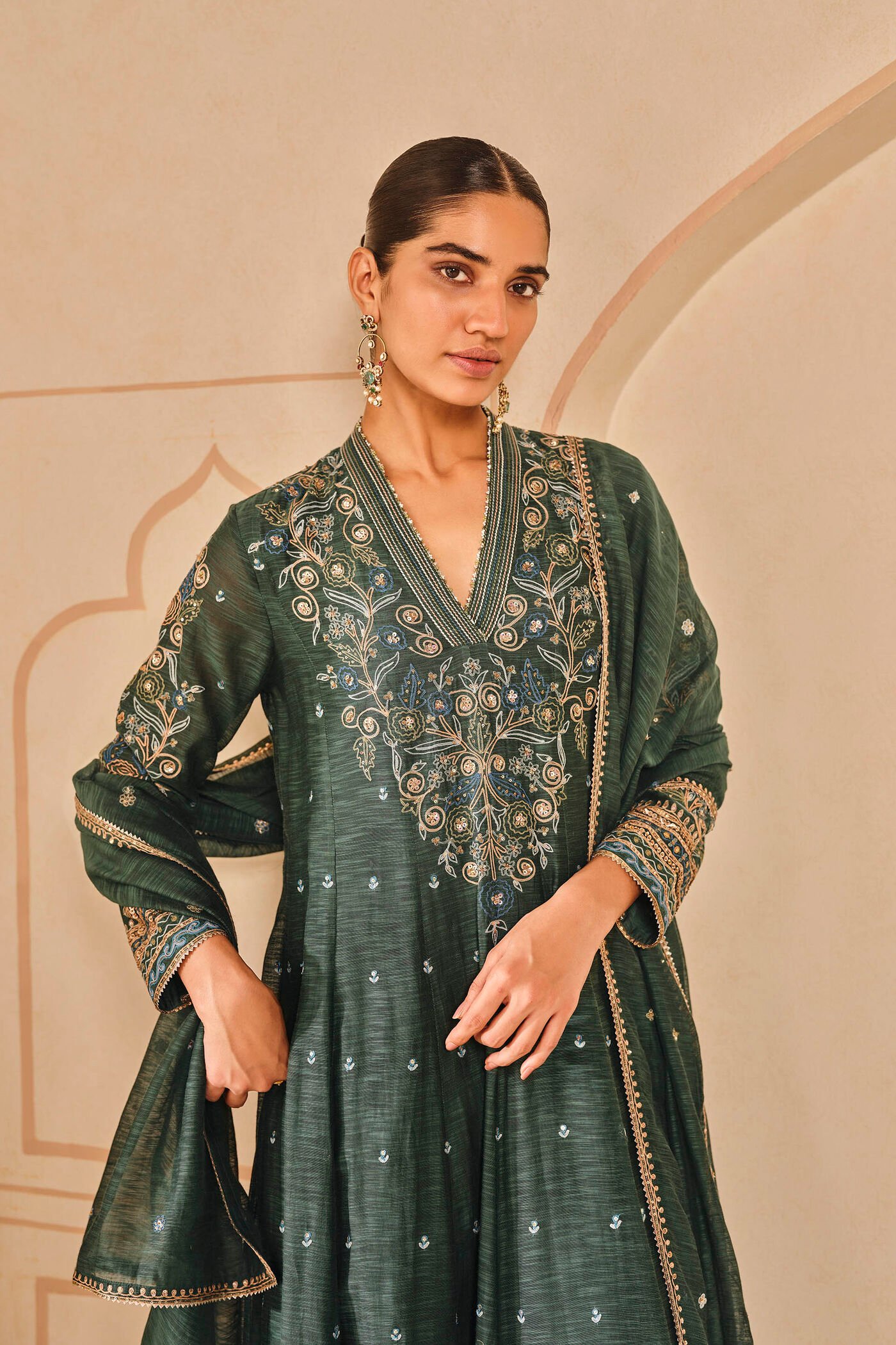 Dark green embroidered kurta set with palazzo pants, traditional Indian festive wear for women