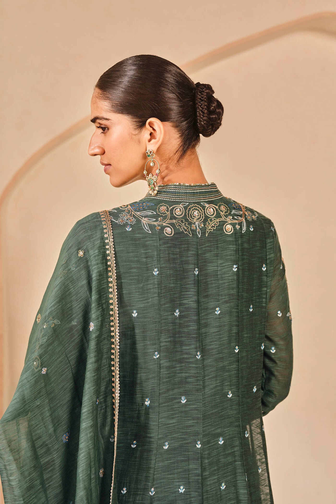 Dark green embroidered kurta set with palazzo pants, traditional Indian festive wear for women