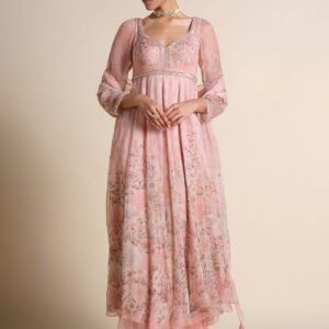 Blush pink floral embroidered Anarkali suit with sheer dupatta and full sleeves worn by model in studio background